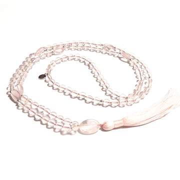 Handmade Love Mala Necklace – Rose Quartz Heart Chakra Healing curled on table